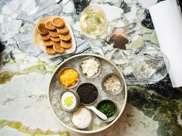 caviar and happy hour drinks at Botanical Hotel