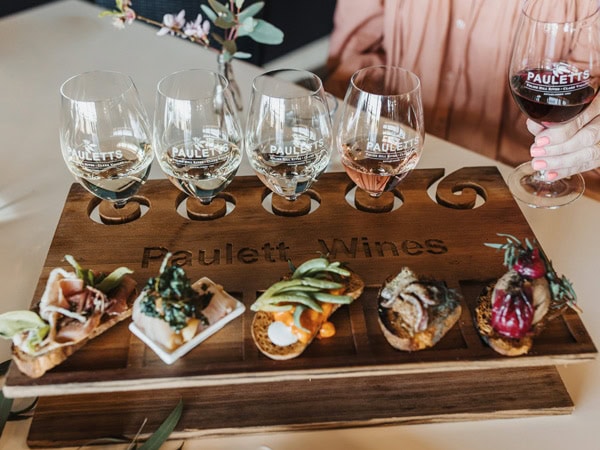 a food platter with matching wines at Bush Devine Winery Restaurant