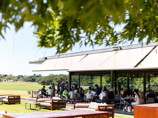 people dining at Centennial Homestead with plenty of seats outside