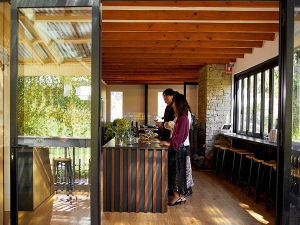 people tasting wines inside the cellar door of Cobbs Hill Estate