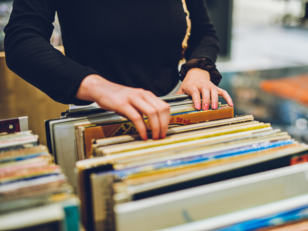Woman flicking through old records