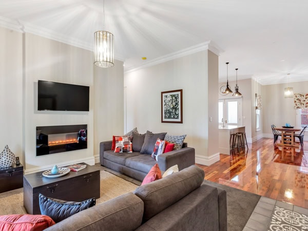 the living room with a fireplace at Grandview Accommodation Flaxley Apartments