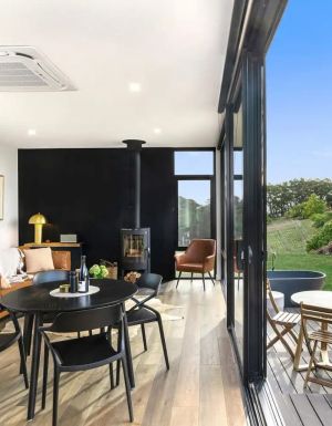 the interior of Espira Airbnb in Adelaide Hills with floor-to-ceiling windows
