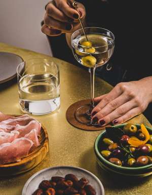 basque lomo with drinks and light snacks on the table at Gildas