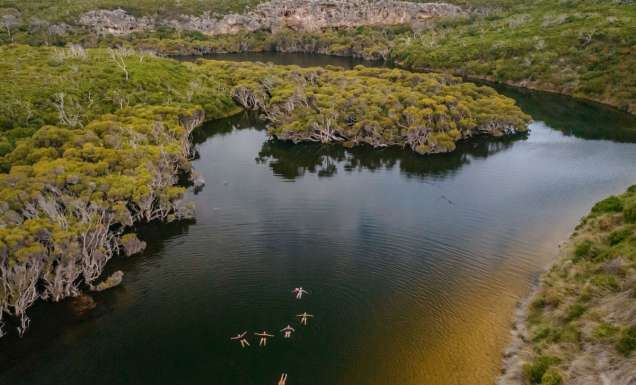 an aerial view of women floating above Margaret River