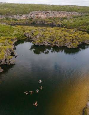 an aerial view of women floating above Margaret River