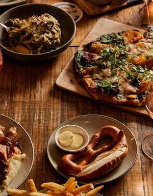 table spread of beer and food at The Haus Restaurant in Handorf South Australia