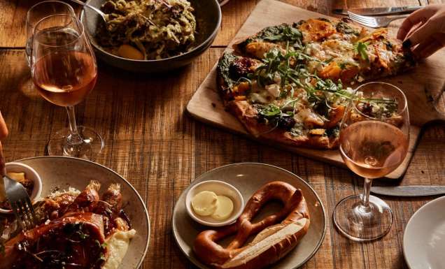 table spread of beer and food at The Haus Restaurant in Handorf South Australia