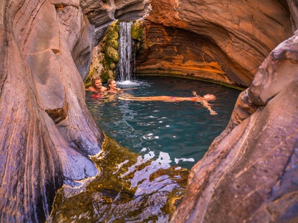 friends swimming at Hamersley Gorge