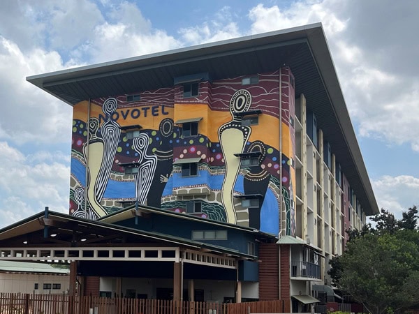 an Indigenous mural at the facade of Darwin Airport Resort