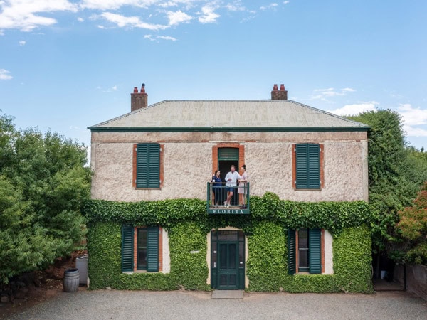 friends drinking wine by the balcony at Jim Barry Wines