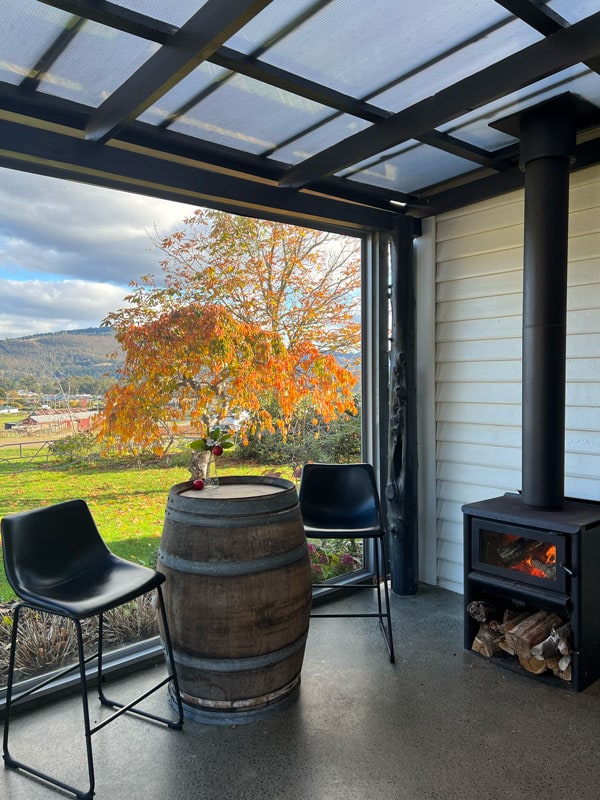 the outdoor deck with a fireplace at Kate Hill Wines