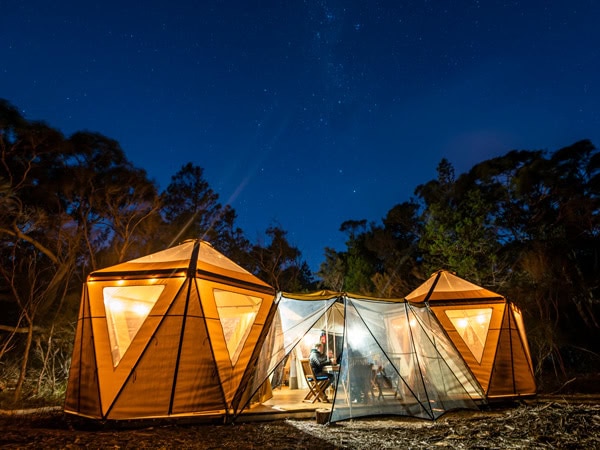 a communal tent under the night sky on Flinders Island