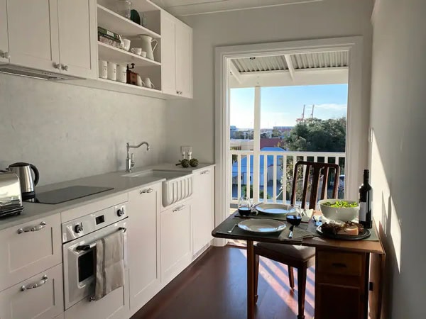 a kitchen with balcony at Le Cherche-Midi
