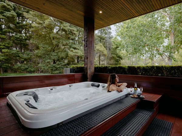 a woman relaxing in a jacuzzi at Losari Retreat