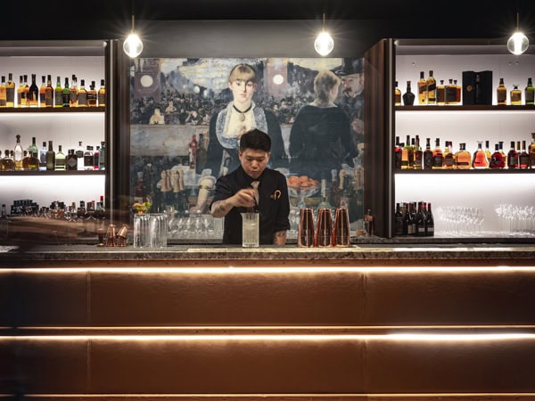 mixologist Jason Lau at the bar counter of Lumière on Thirty Five