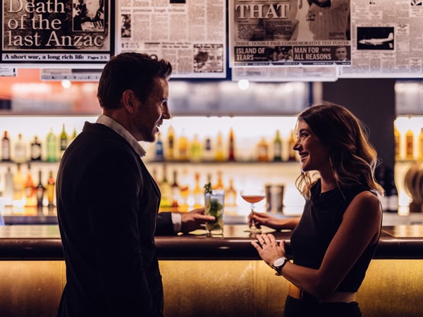 a couple enjoying drinks at The Story Bar, MACq01