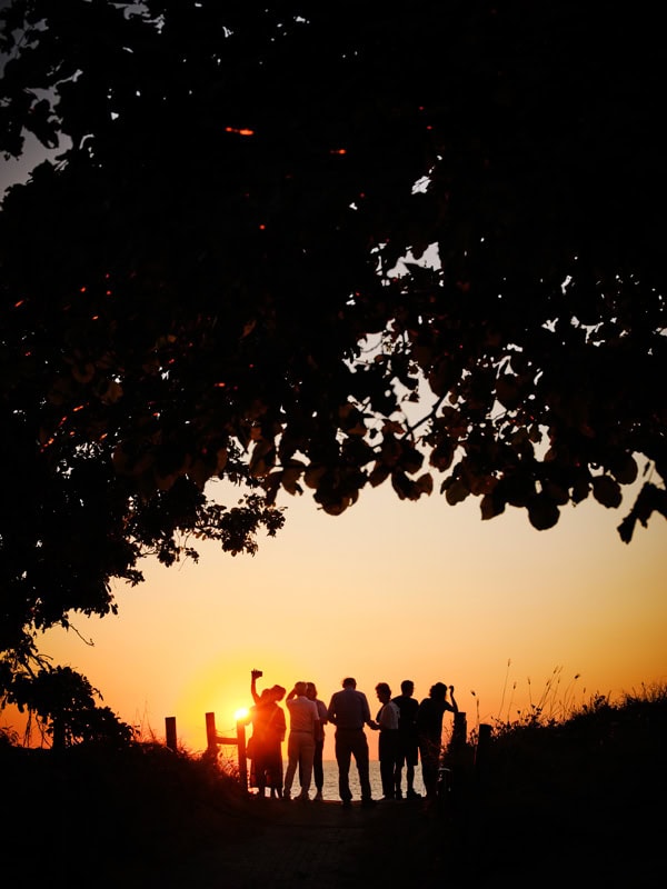 people silhouetted against the sunset at Mindil Beach