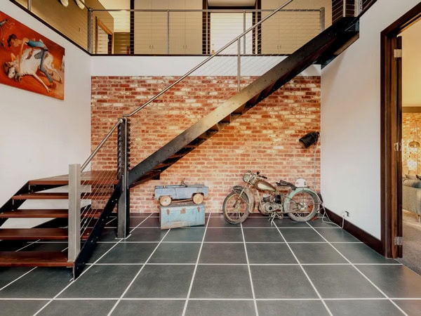 a motorbike under the stairs inside the farm stay at Mount Torrens