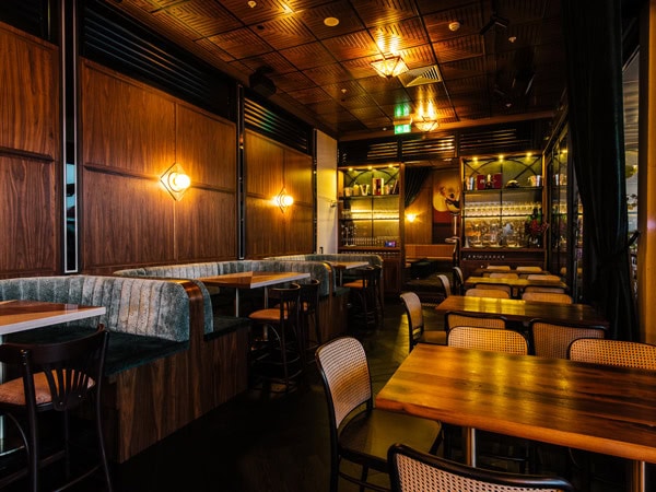 the dining interior of Nick and Noras with dim mood lighting