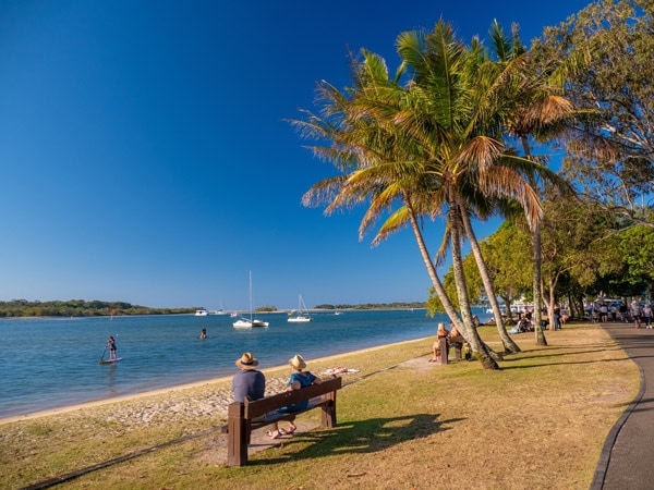 a couple sitting by the bench at Noosaville Gympie Terrace