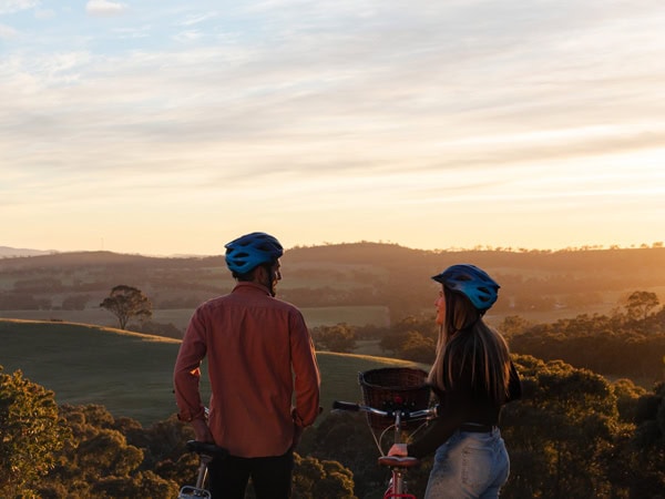 a couple admiring the view from Paulett Wines’ Bush DeVine Restaurant in Polish Hill