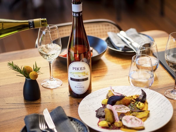 food and wine on the dinner table at Pikes Wines