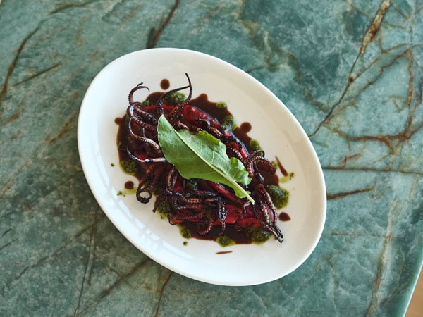 a char-grilled baby octopus at Pipi's Kiosk