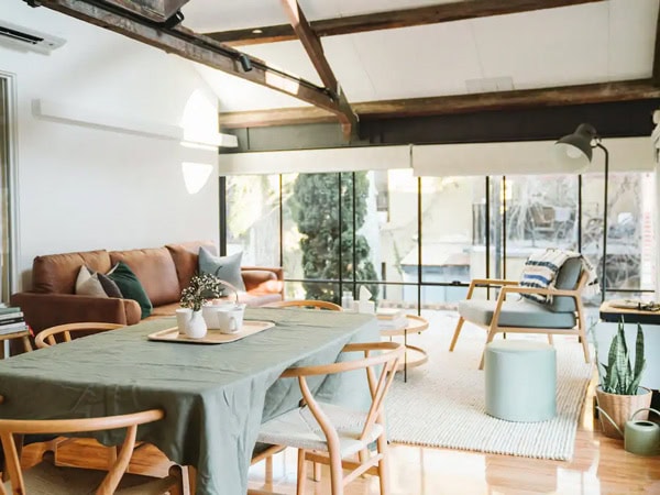 the spacious living room with black steel framed windows at Poet's Harbour, Fremantle