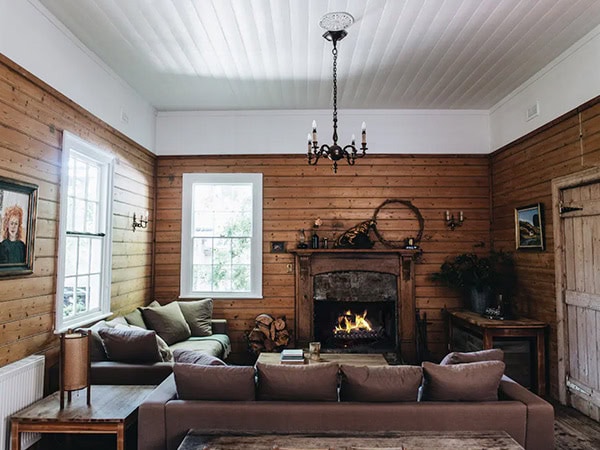lounge room and fireplace at Poet's Lodge, Daylesford VIC