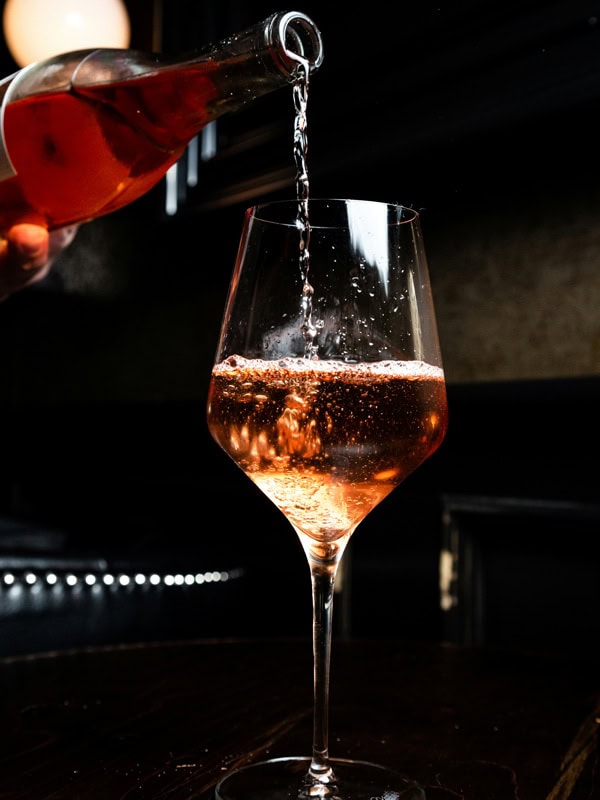 pouring wine into a glass