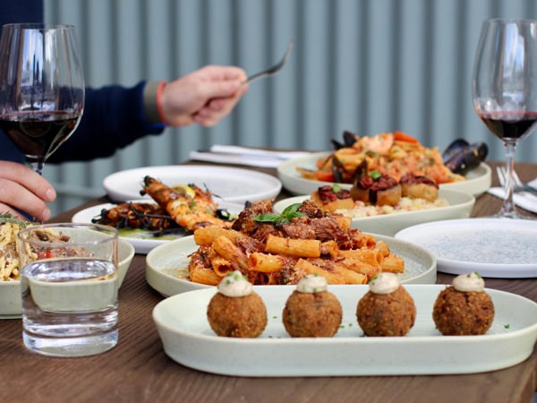 mushroom and truffle arancini and pasta with wine at Ragu and Co