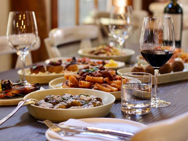 an array of Italian dishes on the table at Ragu and Co
