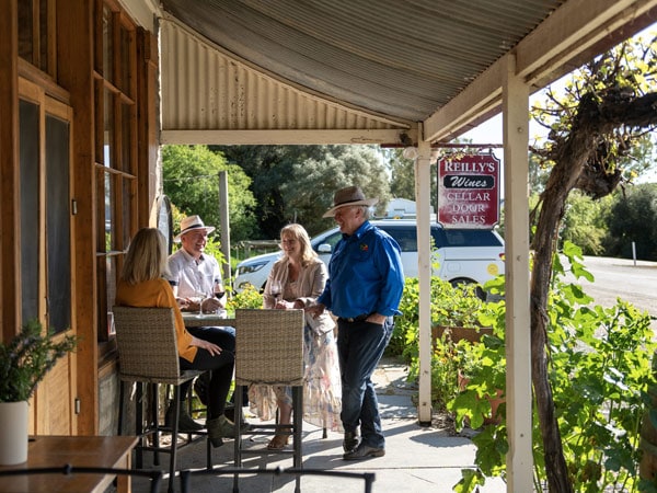 old people dining outside Reilly’s Restaurant