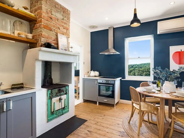 the kitchen and dining area at Rossini's Cottage