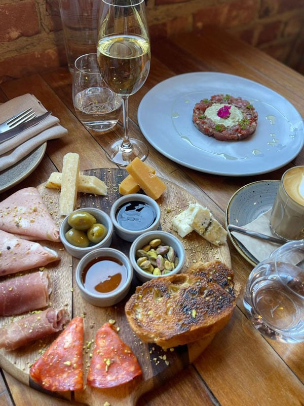 specialty cheeses and meat on a platter at Seed Clare Valley