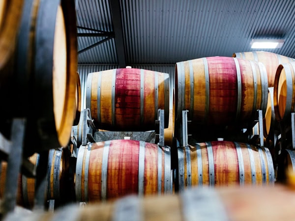 a stack of wine barrels at Shaw + Smith
