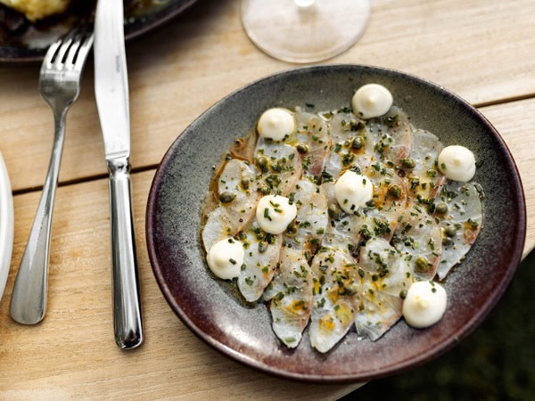 a kingfish dish on the table at Stanley Bridge Tavern