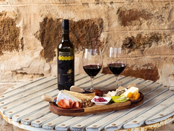 a food platter with two glasses of wine at Taylors Wines