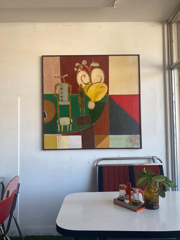 a painting on the wall inside The Cool Room cafe in Fremantle