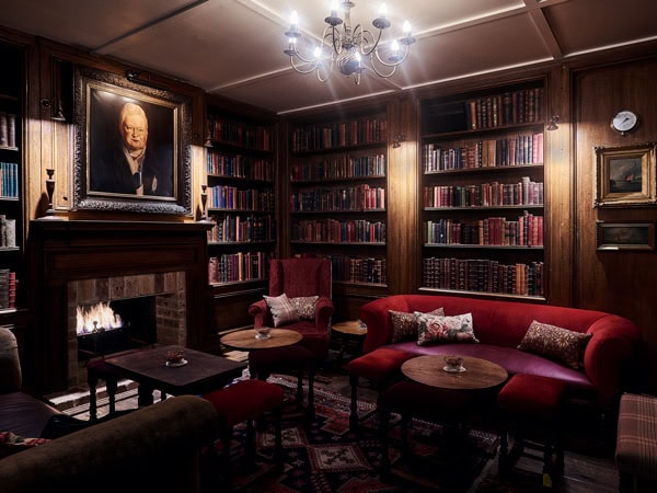 The Duke of Clarence library interior and fireplace