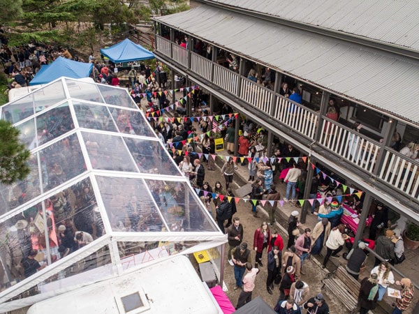 an aerial view of the crowds gathering outside The Scenic Hotel