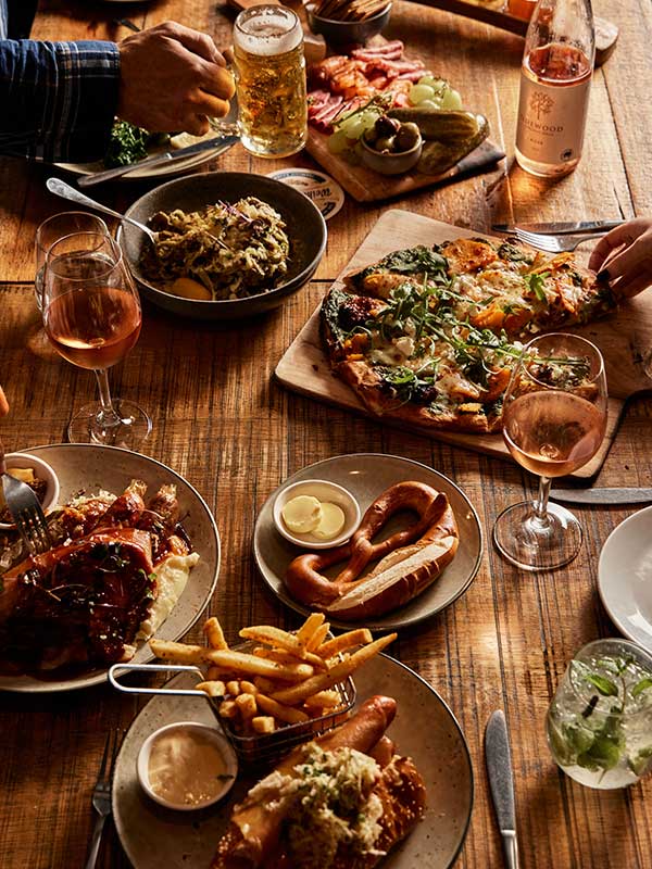 table spread of beer and food at The Haus Restaurant in Handorf South Australia