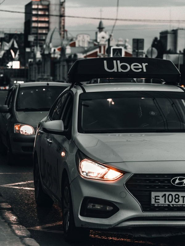 an uber taxi on the road