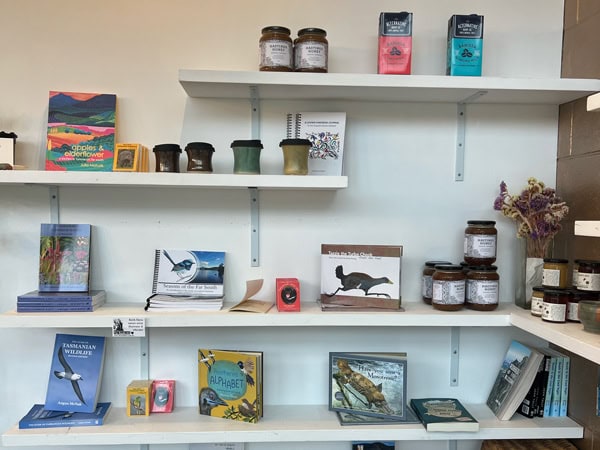 books, honey and ceramic cups on display at Wild Bird