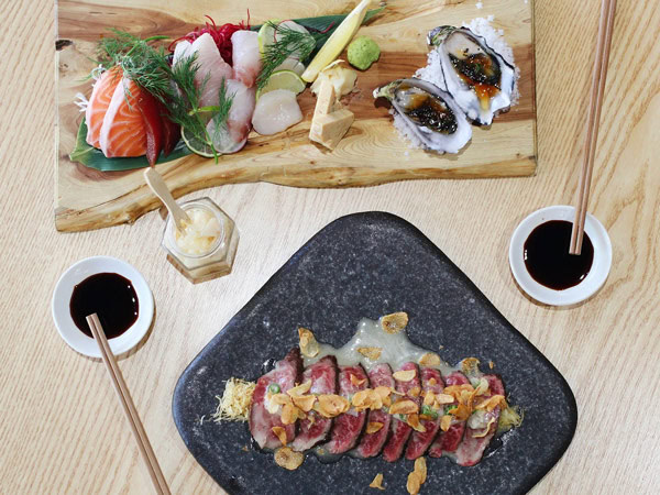 an array of Japanese food on the table at Yuki in the Hills