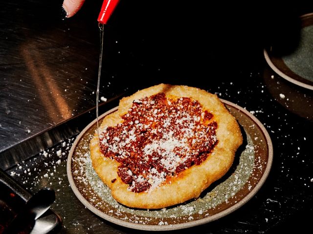 a fried pizza topped with honey at Smith + Daughters, Melbourne