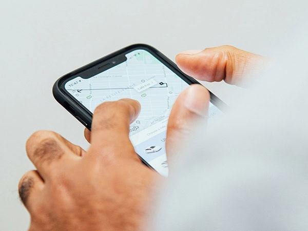 someone booking a ride through the uber app