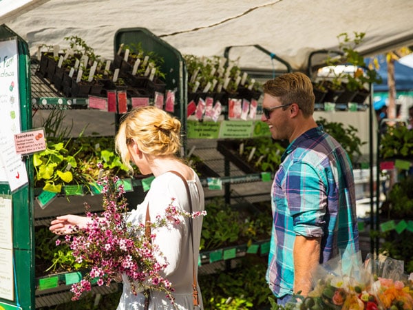 a couple buying flowers at Adelaide Farmers Market