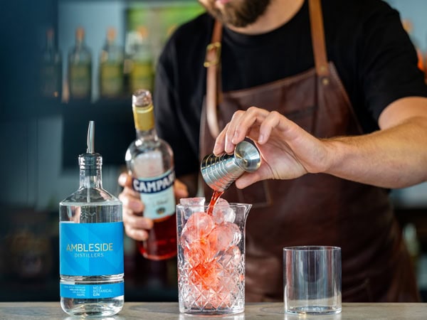 a bartender mixing drinks at Ambleside Distillers